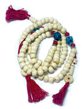 Tibetan bone mala with turquoise Chupsey beads laid flat