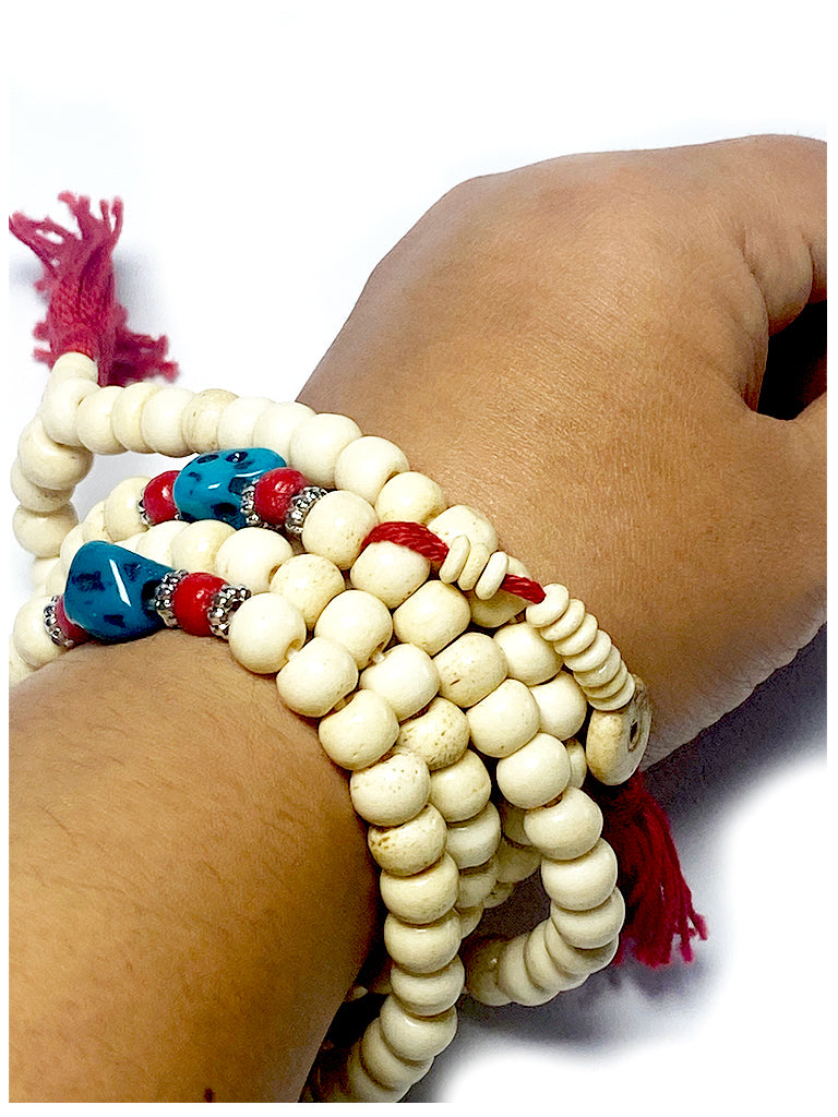 Tibetan bone mala worn as bracelet on wrist