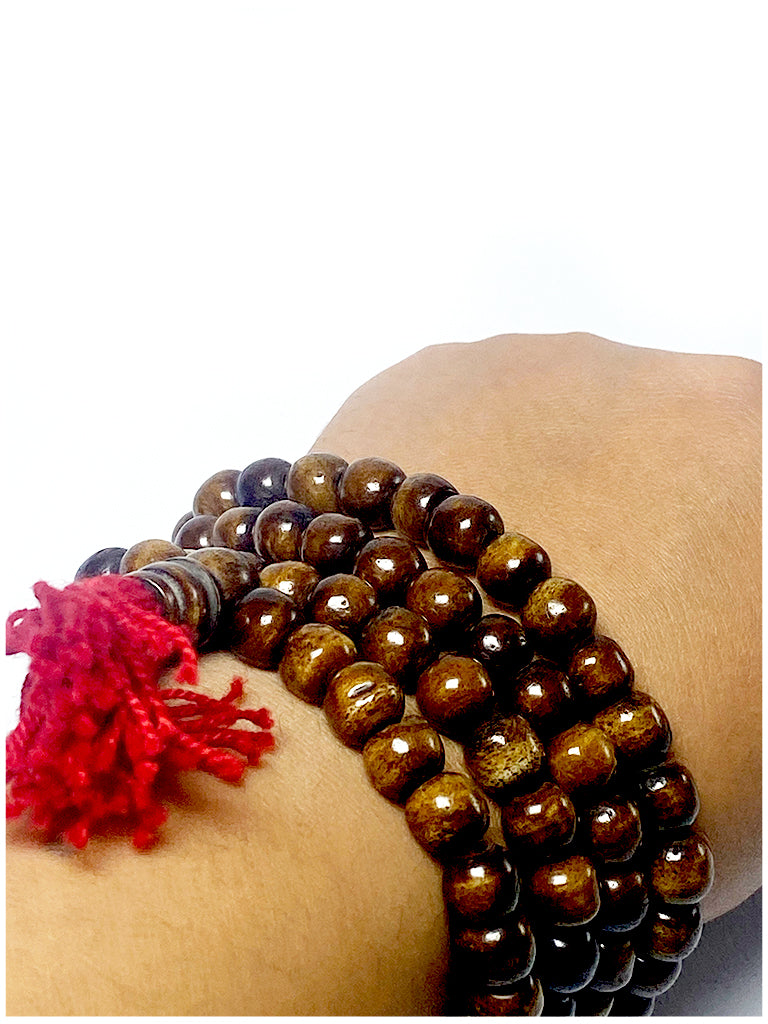 Tibetan coffee bone mala worn as bracelet on wrist