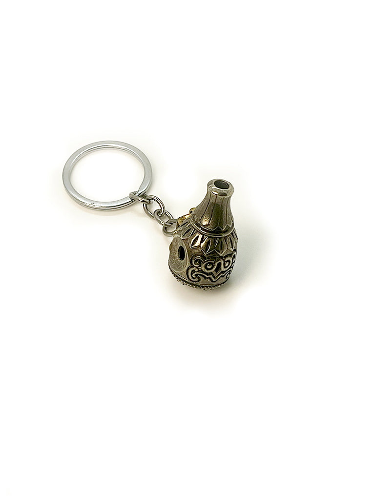 Tibetan Bumpa ritual vase keychain detail view