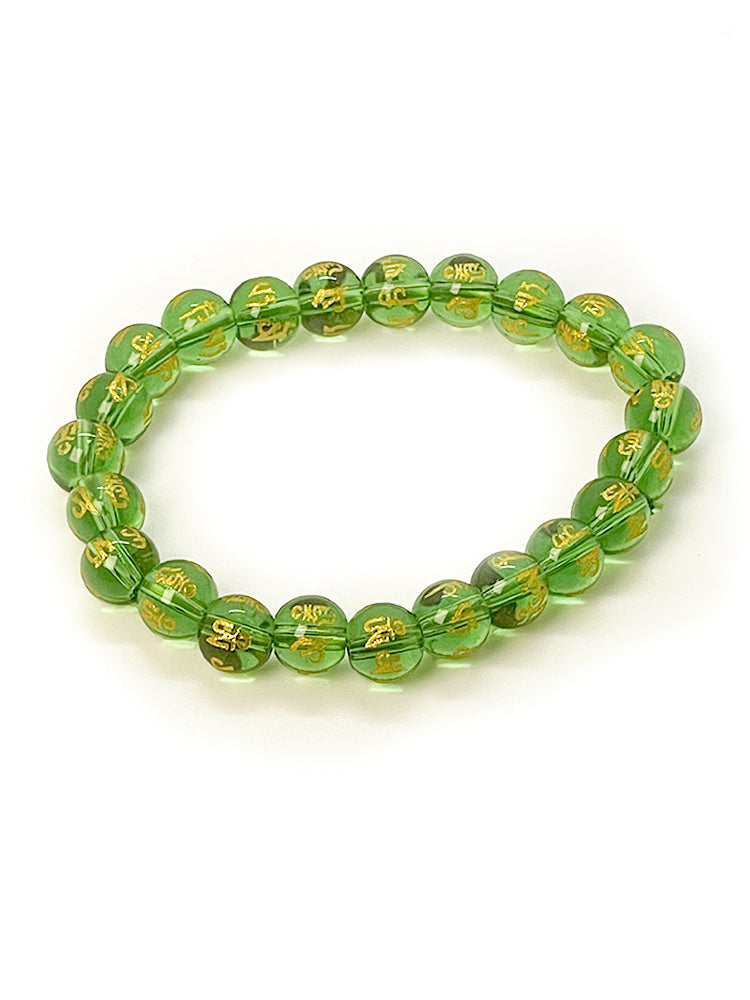 Green Om Mani Padme Hum glass bead bracelet close-up